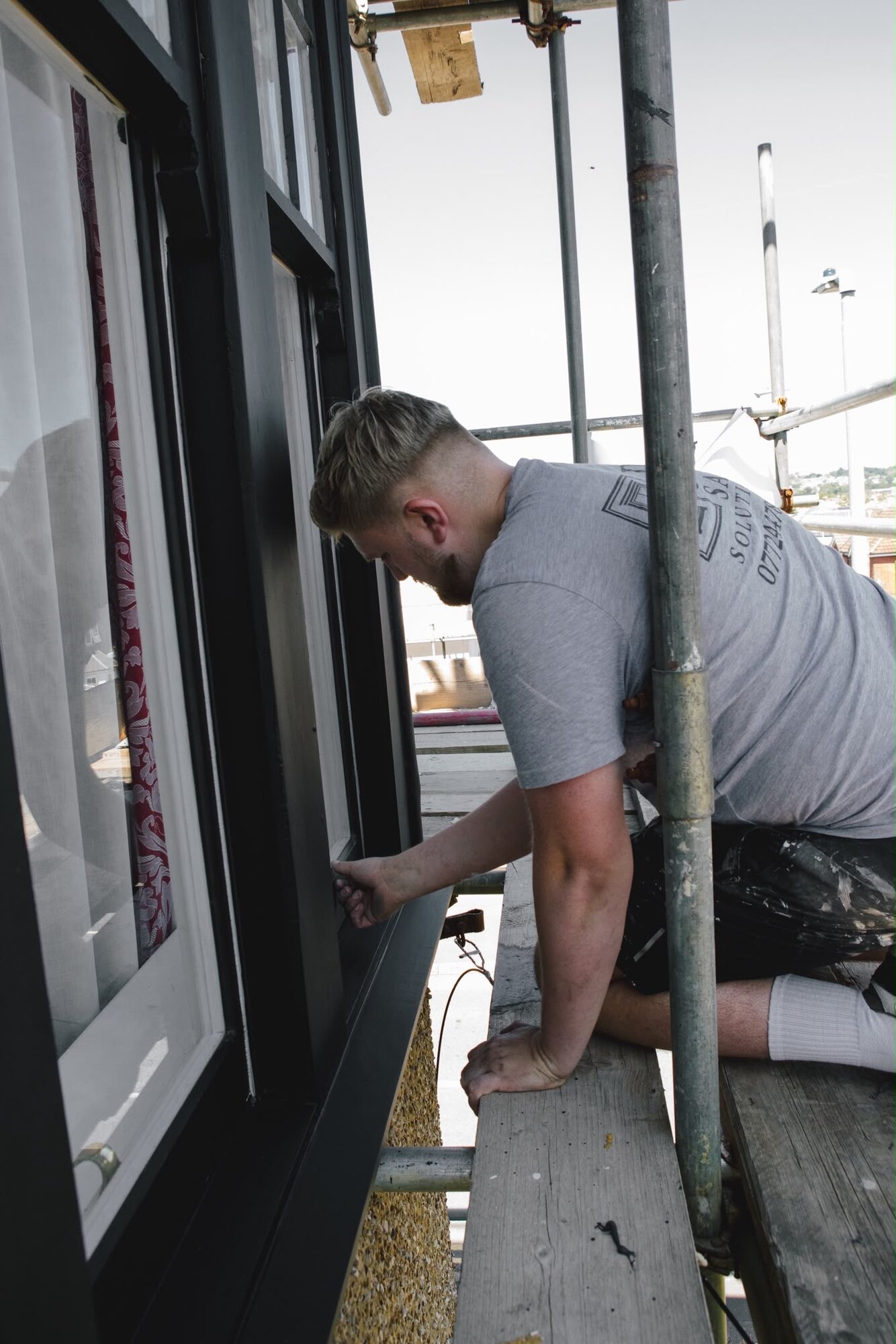 JR Sash Solutions tradesperson finishing a window frame on site