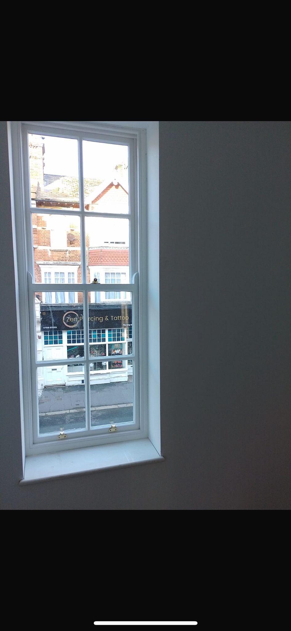 Tall narrow sash window interior