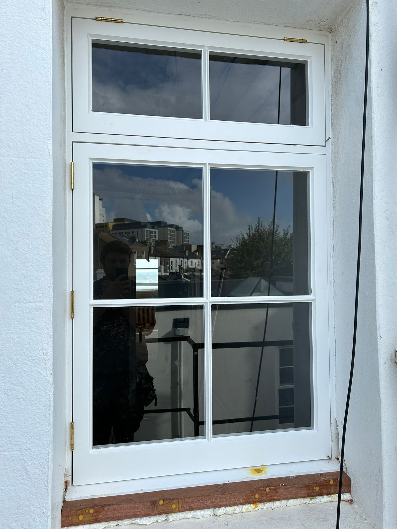 New casement window with brass hinges