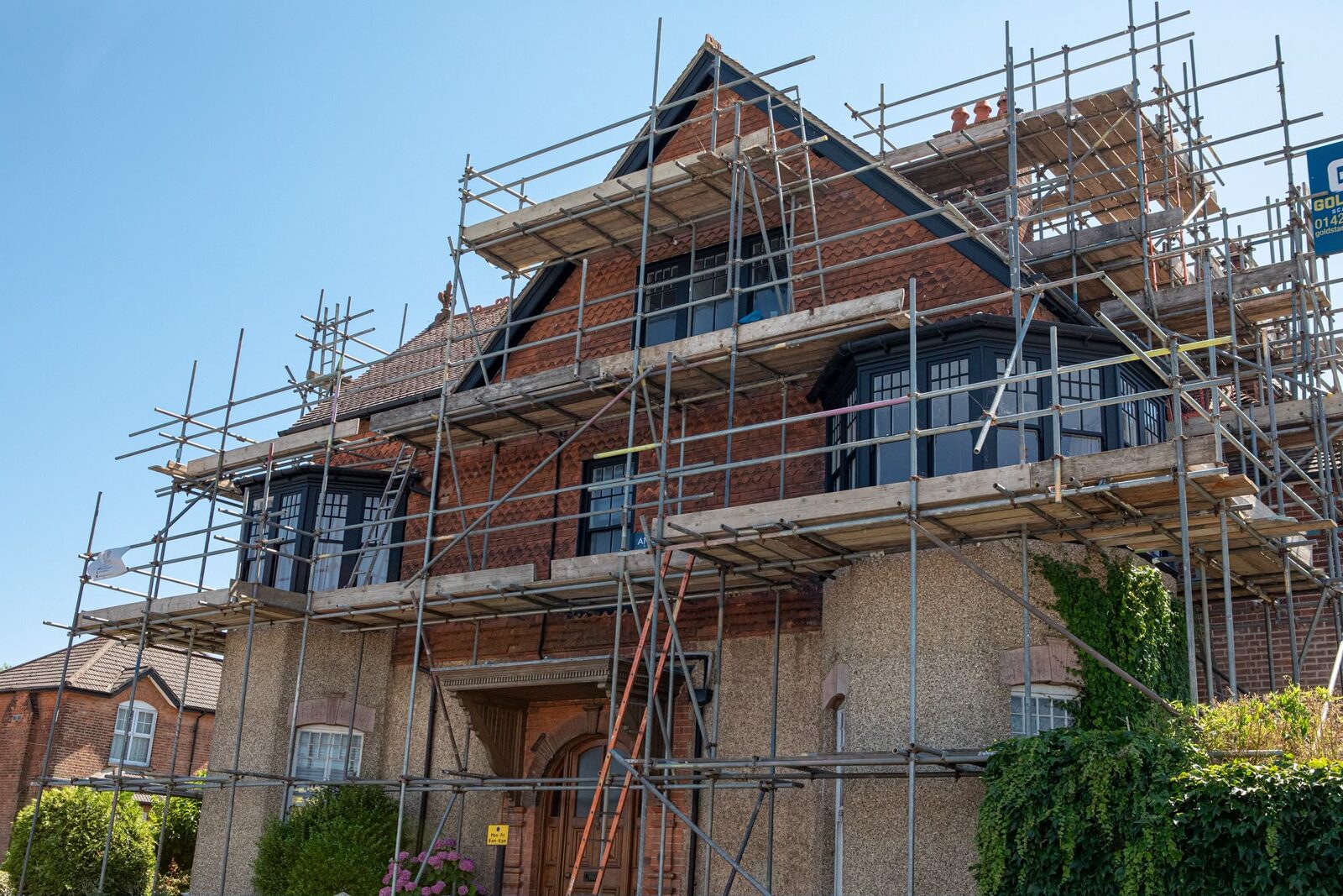 Full scaffold elevation of period house window renovation